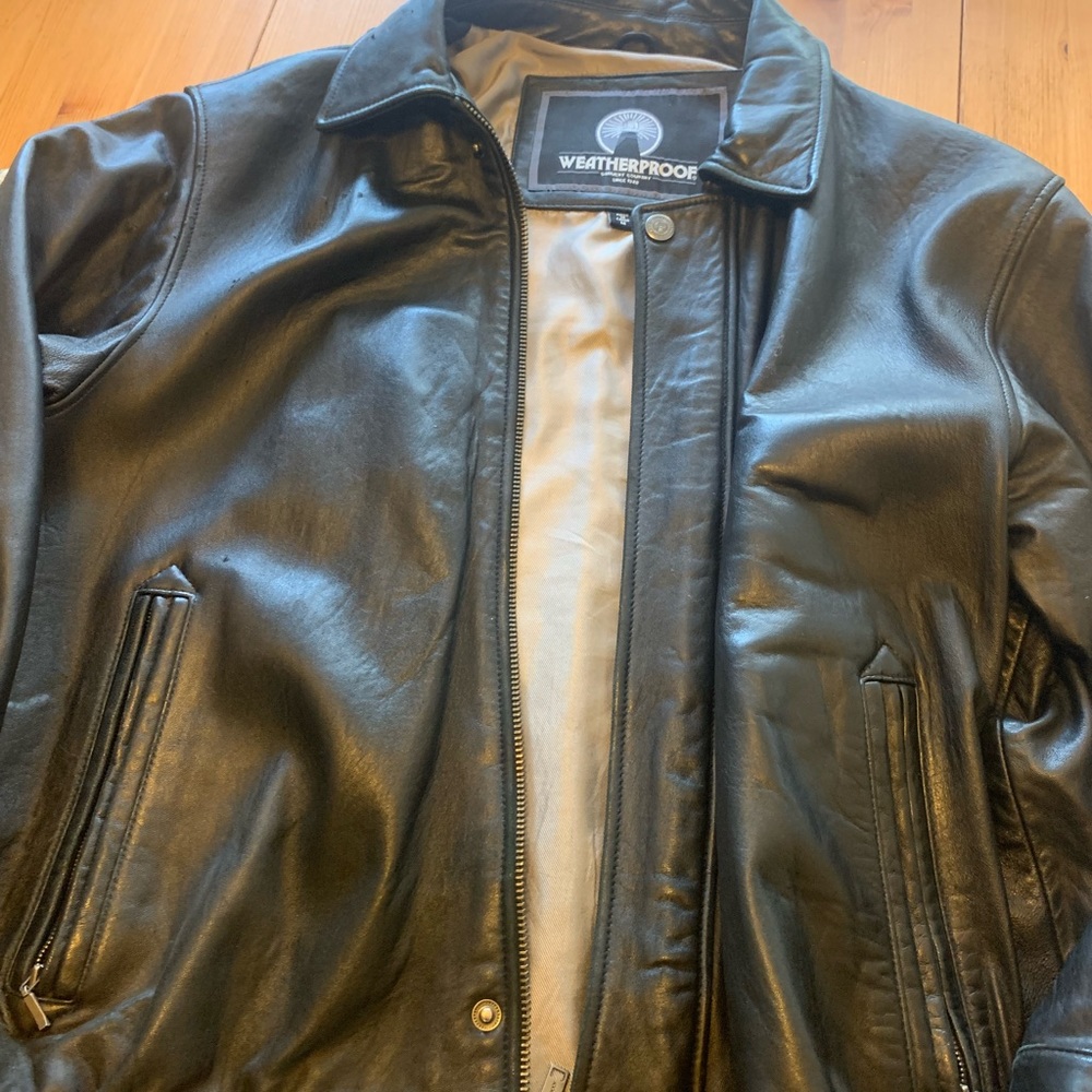 Men’s dark brown leather coat.  Size: Med.